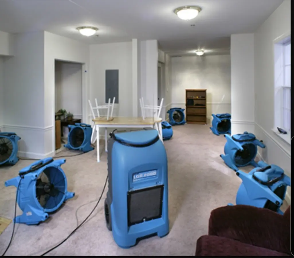 Air movers and dehumidifier setup for Water Damage Restoration in Kenwood